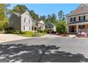 Neighborhood street view featuring well-maintained homes with manicured lawns and mature trees at 217 Christina Ct, Peachtree City, GA 30269