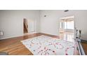 Open-concept living room with hardwood floors and ample natural light at 2550 Columbia Crossing Ct, Decatur, GA 30034