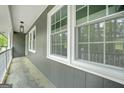 Covered front porch featuring classic details and a welcoming entrance at 3387 Oak Dr, Lawrenceville, GA 30044
