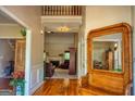 Inviting foyer with hardwood floors, high ceilings, and a glimpse into the living room at 1730 Carlington Ct, Grayson, GA 30017