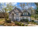 Traditional two-story home with a side entry two-car garage and a manicured lawn at 3139 Players Dr, Jonesboro, GA 30236