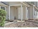 Inviting entryway with covered porch, showing the front door and neutral siding at 1109 Allen Rd, Grantville, GA 30220
