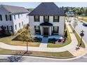 Two-story home with black shutters, elegant landscaping, and a well-manicured lawn at 1461 Thomas St, Conyers, GA 30094