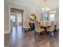 Dining room featuring hardwood floors, chandelier lighting, and elegant decor at 1461 Thomas St, Conyers, GA 30094