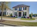 Charming two-story home featuring a landscaped front yard with a stylish entry and black shutters at 1461 Thomas St, Conyers, GA 30094