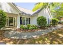 Traditional style home with manicured bushes and shade trees at 12843 Simmons Rd, Hampton, GA 30228