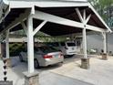 Covered carport featuring stone pillars and two parked vehicles at 363 Palmetto Rd, Tyrone, GA 30290