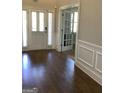 Elegant entryway featuring hardwood floors, wainscoting, and a view of a bright office at 160 Elysian Dr, Fayetteville, GA 30214