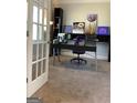 Bright home office features modern desk, decor and white french door entrance at 160 Elysian Dr, Fayetteville, GA 30214