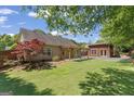 View of backyard featuring a covered patio and detached building at 421 Bear Cub Path, Social Circle, GA 30025