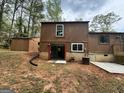 Backyard view of the house featuring a walkout basement at 862 Bridgewater Ct, Stone Mountain, GA 30088