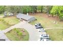 Expansive property showcases a well-kept home with lush green lawns and a long driveway with plenty of parking at 140 Stoneview Cir, Covington, GA 30016