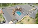 Aerial view of the house boasting an in-ground pool, deck area, and well-maintained surroundings at 5380 Somerlane Trl, Atlanta, GA 30349