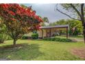 This home boasts a covered carport and lush landscaping, adding to its curb appeal at 6950 Shannon Dr, Lithia Springs, GA 30122