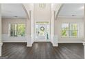 Bright foyer with views of the exterior, featuring wood floors and stylish wainscoting at 634 Gardner Rd, Stockbridge, GA 30281