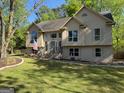 A spacious lawn and manicured landscaping enhance the curb appeal of this two-story residence at 11 Line Creek Cir, Sharpsburg, GA 30277