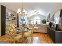 Elegant dining area with chandelier, seating for six, and views of the living room at 3417 Double Eagle Dr # Bldg 31, Marietta, GA 30008