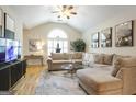 Bright living room featuring a large window, vaulted ceilings, and stylish decor at 3417 Double Eagle Dr # Bldg 31, Marietta, GA 30008