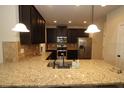Gourmet kitchen featuring granite counters, stainless appliances, and a spacious island at 316 Trulove Lane Lot 35 # 35, Locust Grove, GA 30248