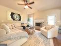 Comfortable living room with a brick fireplace and cozy seating at 328 Trulove Lane Lot 32 # 32, Locust Grove, GA 30248