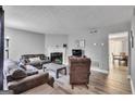 Cozy living room featuring a fireplace, comfortable sofas, and stylish decor at 2998 Kenville Ln, Decatur, GA 30034