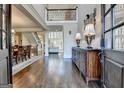 Grand foyer showcasing soaring ceilings, hardwood floors, and elegant staircase at 10125 Brixton Pl, Suwanee, GA 30024
