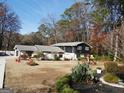 Charming exterior view of a two-story home featuring a well-maintained front yard and inviting curb appeal at 4213 Janice Drive, Atlanta, GA 30337