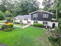Inviting front yard features vibrant landscaping, lush green lawn, and a charming facade at 4213 Janice Drive, Atlanta, GA 30337