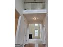 Bright foyer with hardwood floors, high ceilings, and a view into the living room at 6281 Vinings Vintage Dr, Mableton, GA 30126
