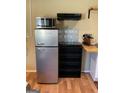 This well-organized kitchenette has a small fridge and countertop space at 6052 Pine St, Austell, GA 30106