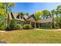Beautiful exterior view of home showing porch and manicured lawn at 410 Wicklow St, Tyrone, GA 30290