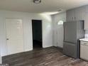 Spacious kitchen boasts stainless steel appliances, light gray cabinetry, and modern finishes at 30 Laurel Way, Covington, GA 30016