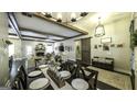 Open floor plan shows dining room with beams and views of the living room at 5133 Woodmond Dr, Villa Rica, GA 30180