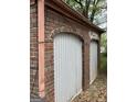 Garage area showing weathered brick and archways over doors needing rehab at 250 Mathewson Sw Pl, Atlanta, GA 30314
