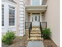 Charming front entrance with stone steps and a decorative front door with glass design at 3328 Sulky Se Cir, Marietta, GA 30067