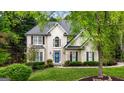 Elegant home with inviting entrance, showcasing its well-maintained landscaping at 102 Santolina Park, Peachtree City, GA 30269