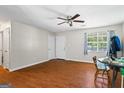 Bright living room featuring hardwood floors, and neutral walls at 195 Riverbend Dr, Covington, GA 30014
