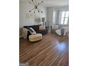 Inviting living area with hardwood floors, contemporary decor, and ample natural light at 6806 Blackstone Pl # 12, Mableton, GA 30126