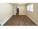 Bright dining area featuring wood-look flooring and natural light from a large window at 1089 Canal St, Decatur, GA 30032