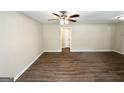 Spacious living room with modern dark wood floors, ceiling fan, and neutral paint at 1089 Canal St, Decatur, GA 30032