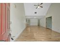 Bright and airy living room features hardwood floors, high ceilings, and neutral paint at 322 Wood Rdg, Peachtree City, GA 30269