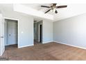 Spacious bedroom with neutral walls, carpet floors, and a ceiling fan with lighting fixture at 2554 Willenhall Way, Lithonia, GA 30058