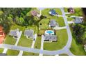A high angle view of several well-maintained properties with green lawns and trees at 155 Lawrence Dr, Villa Rica, GA 30180