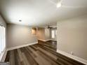 Open living room with modern floors, neutral paint, and lots of natural light at 3456 Glensford Dr, Decatur, GA 30032