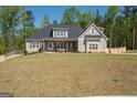 Lovely home with a lush lawn, long driveway, and privacy fence at 115 W Wind Ct, Tyrone, GA 30290