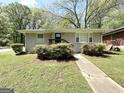 Inviting single-story home with landscaped front yard and charming entryway at 2155 Meador Se Ave, Atlanta, GA 30315