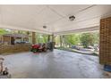 Spacious covered parking area with ample lighting, perfect for vehicle storage and projects at 9155 Lakeview Sw Dr, Covington, GA 30014