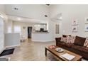 Open-concept living room boasts high ceilings and is connected to the kitchen area at 220 Camerons Way, Covington, GA 30016