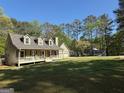 Lovely home with a spacious front yard and a welcoming front porch at 4430 Kings Hwy, Douglasville, GA 30135