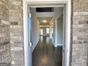 Elegant foyer with hardwood floors, soaring ceilings, and views into the spacious living areas at 502 Hinton Farm Way, Dacula, GA 30019